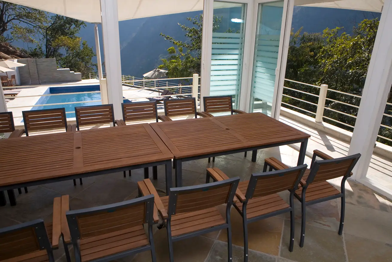 Conference table setup overlooking the pool and hills at Atali Ganga