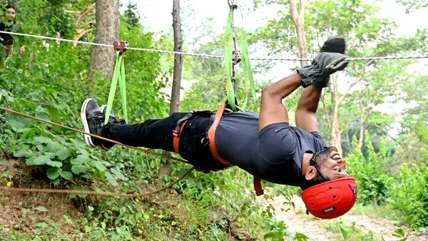 Team member on the zipline during a corporate offsite at Atali Ganga