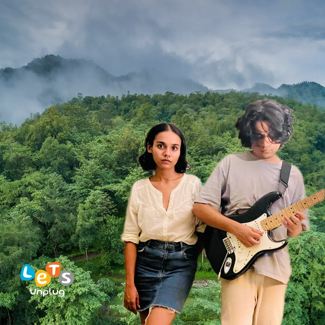 Let's Unplug performer with guitar overlooking the forest at Atali Ganga
