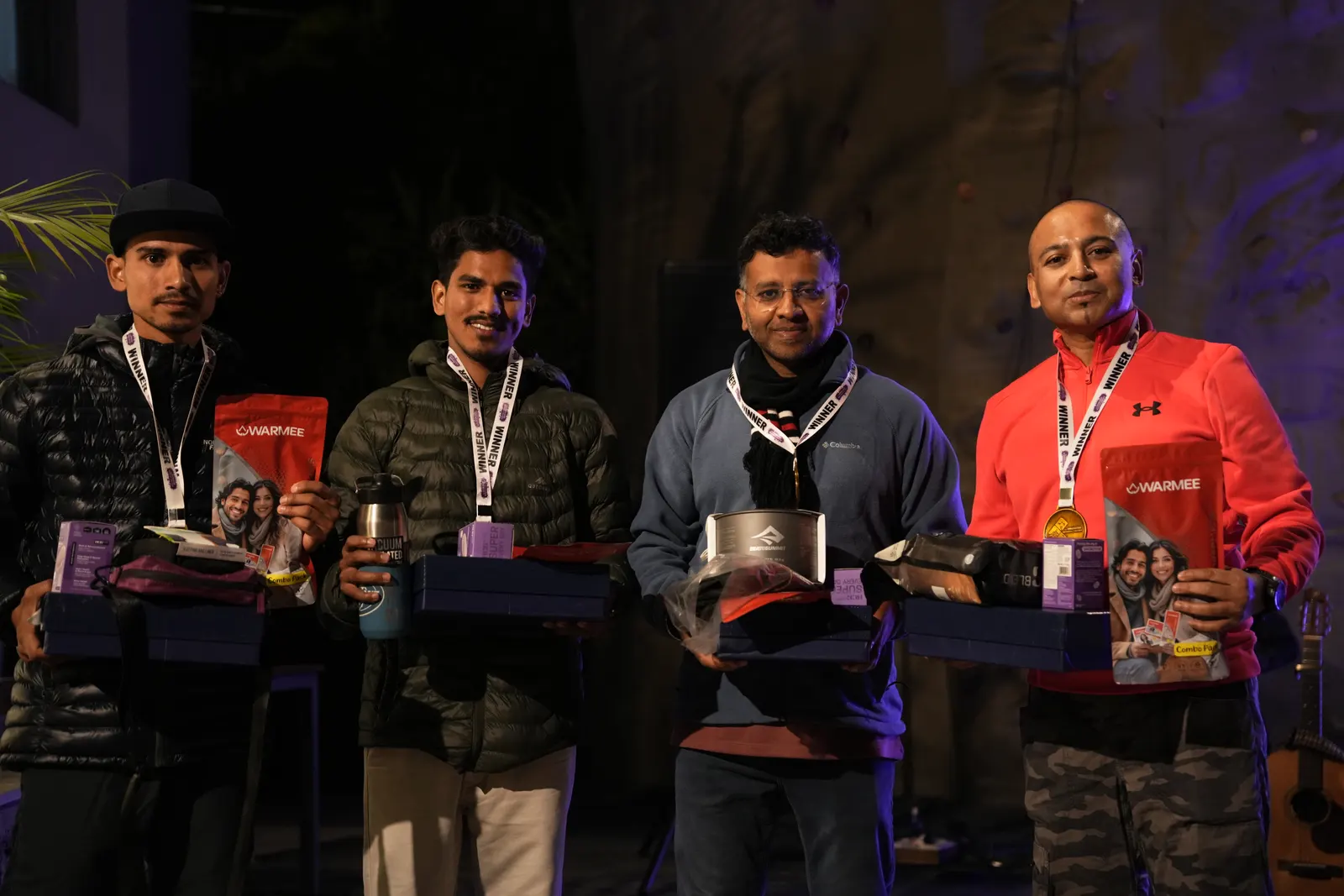 HAC winners posing with medals and prize hampers at the awards night